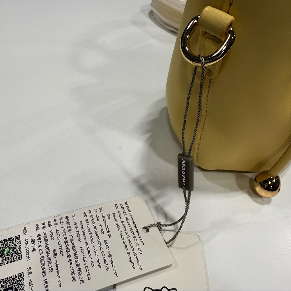 Hello Kitty Yellow Drawstring Crossbody Leather Tote - Picture 9 of 15